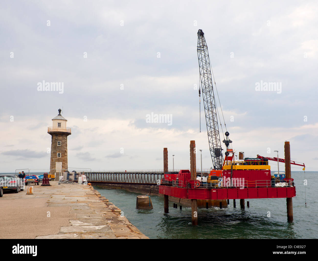 A civil engineering jack-up rig carrying out repairs to the East Pier ...