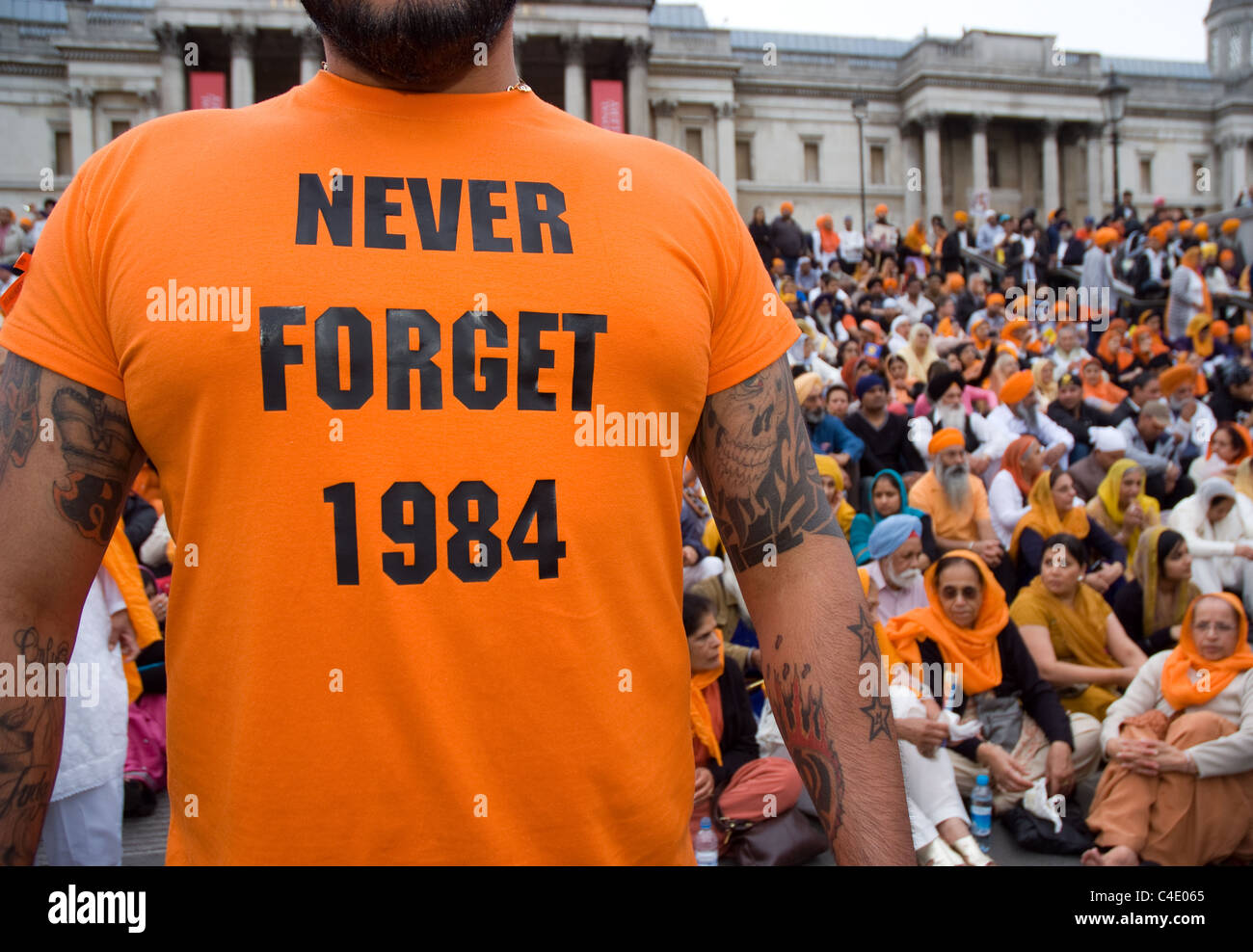 a Sikh man wears a orange never forget 1984 t shirt Stock Photo