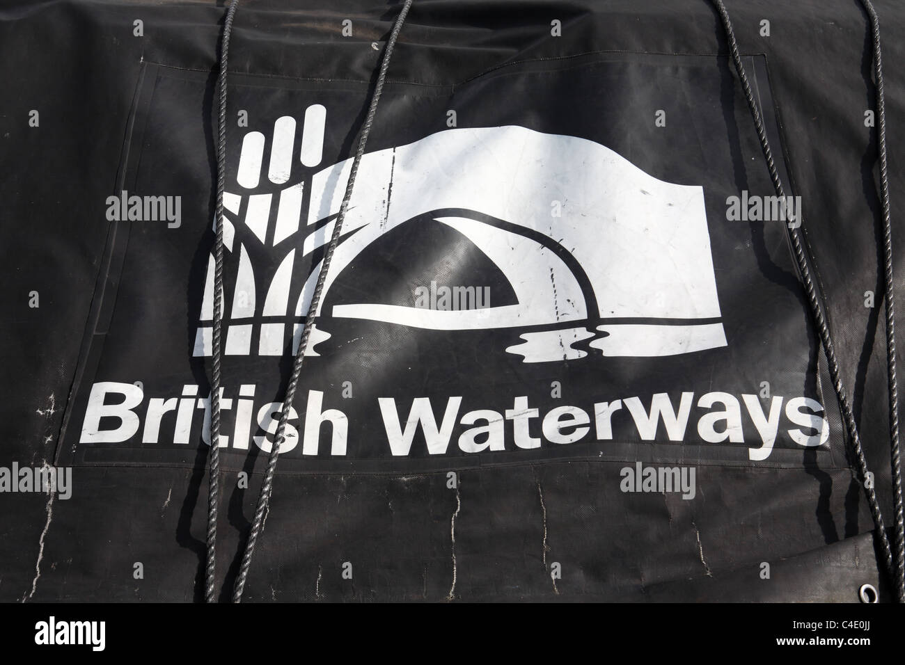 A canal boat cover bearing the words British Waterways and that organisation's symbol or logo. Stock Photo