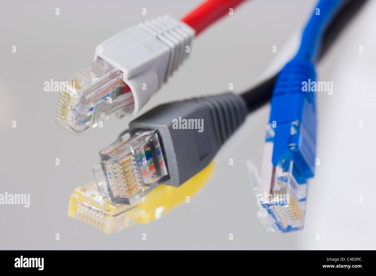 Four RJ-45 Ethernet connectors on white background Stock Photo