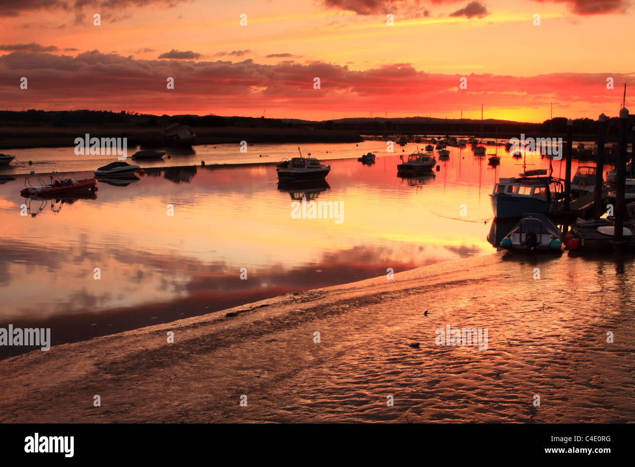 Topsham summer sunset on outgoing tide, view from quay towards Exeter