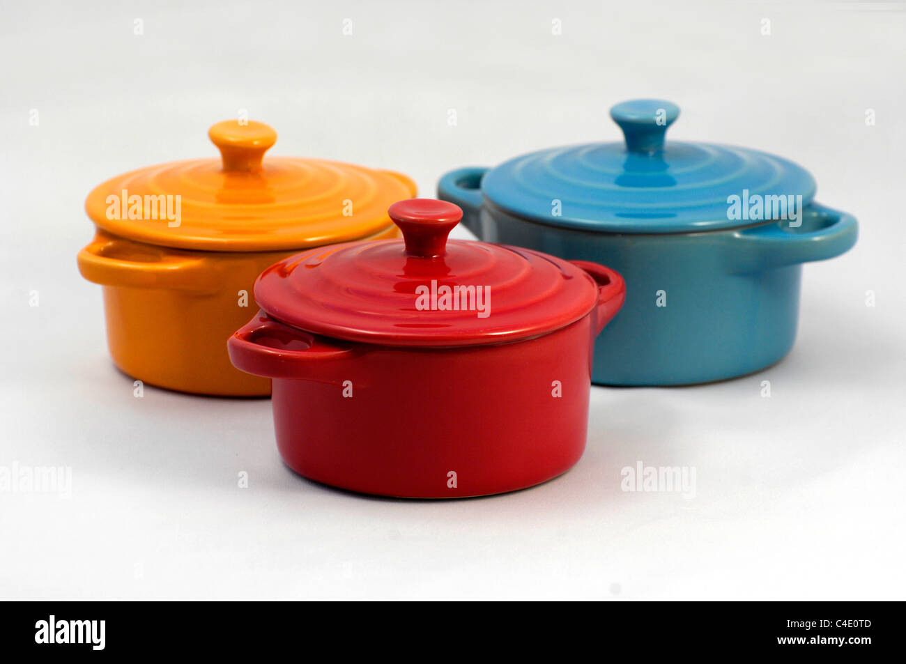 Yellow Blue and Red earthenware on kitchen top Stock Photo