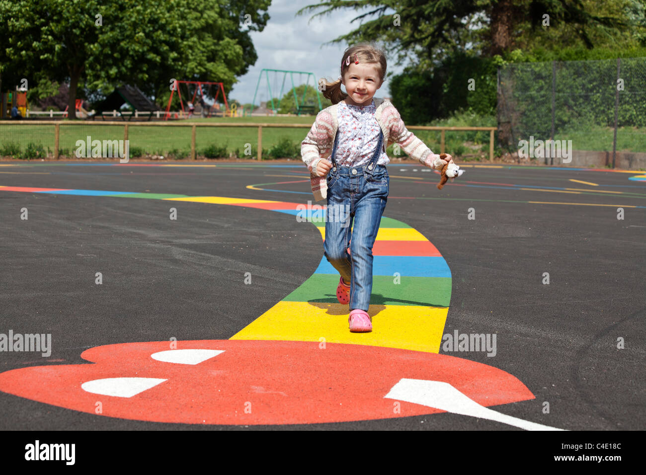 smiling girl on the playground Stock Photo - Alamy