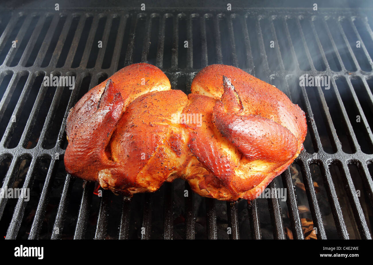 A whole chicken on the grill Stock Photo Alamy