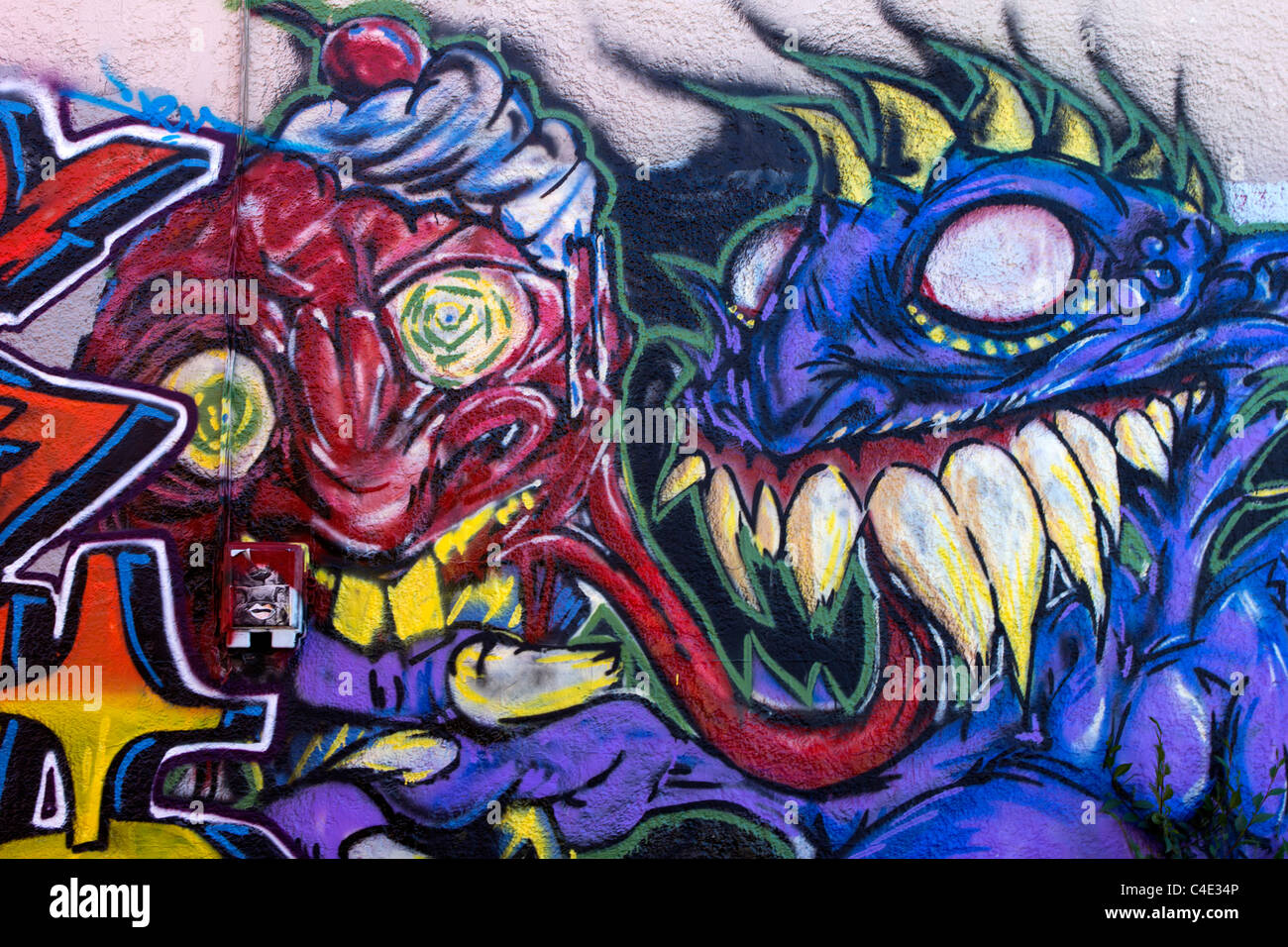 Purple and Red Graffiti Monster Stock Photo - Alamy