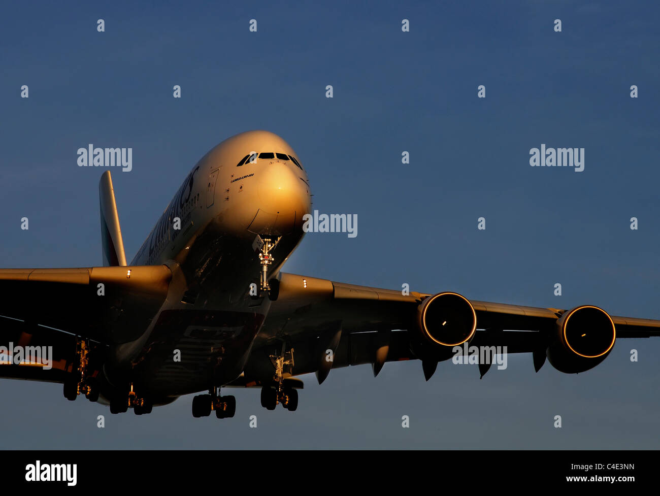 The Airbus A380 landing in the sunset Stock Photo