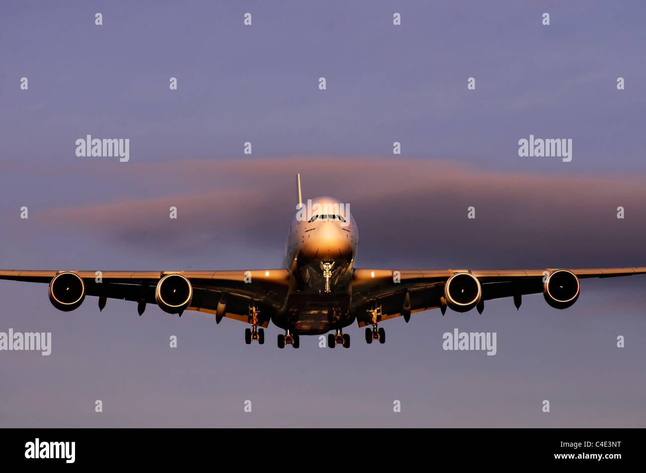 The Airbus A380 landing in the sunset Stock Photo