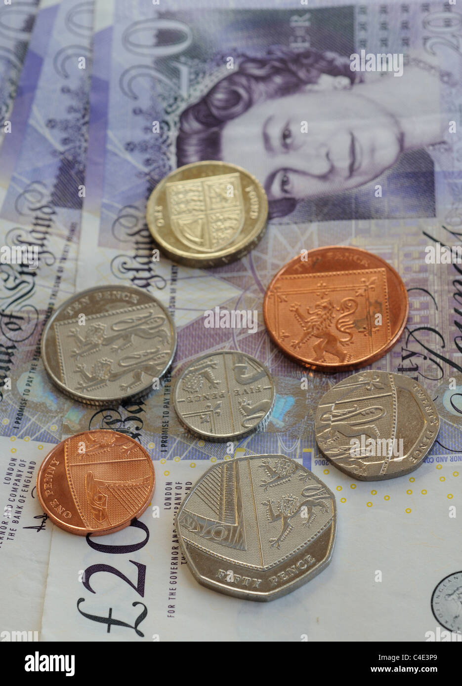 New design UK coins on twenty pound notes Stock Photo