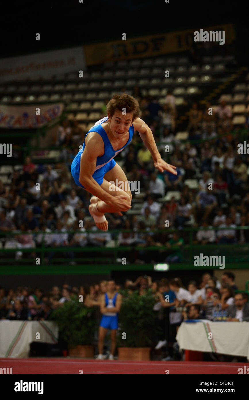 Gymnastics competition a gymnast performing a double back full twist