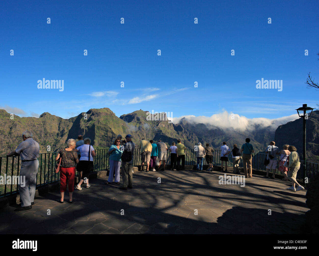 Tourists at Eira do Serrado, viewpoint overlooking the Nuns Valley , Madeira. Stock Photo