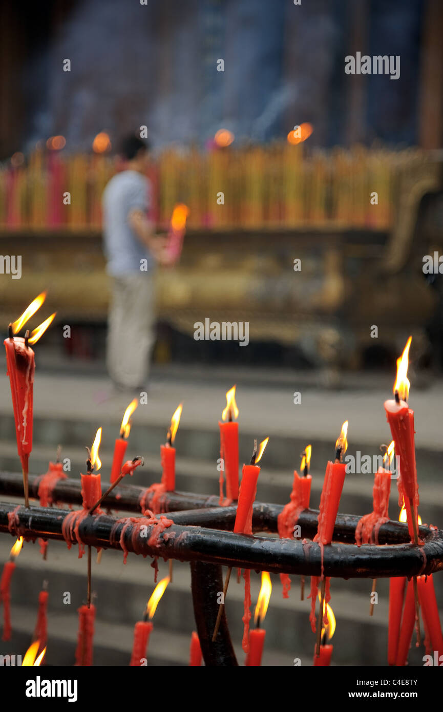 Burning candles in a Buddhist temple in China Stock Photo Alamy