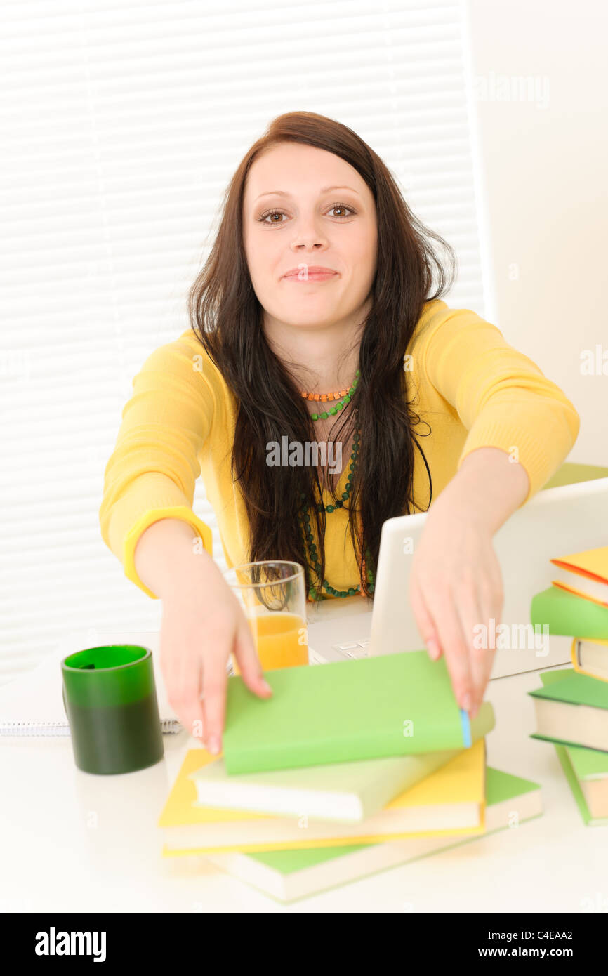 Young student girl with books in student apartment Stock Photo - Alamy