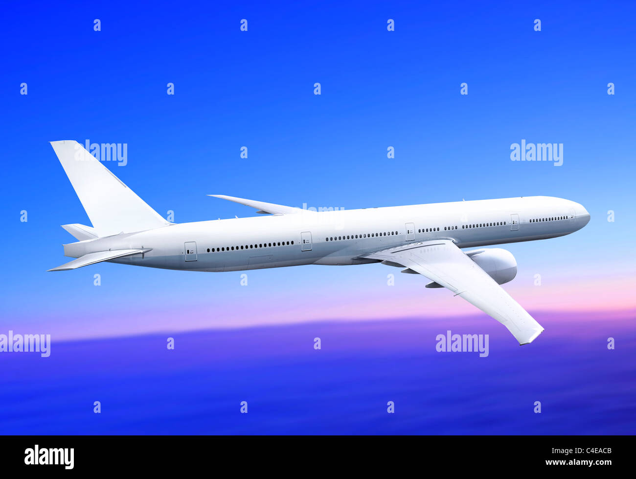 white passenger plane is landing away in the blue sky Stock Photo - Alamy