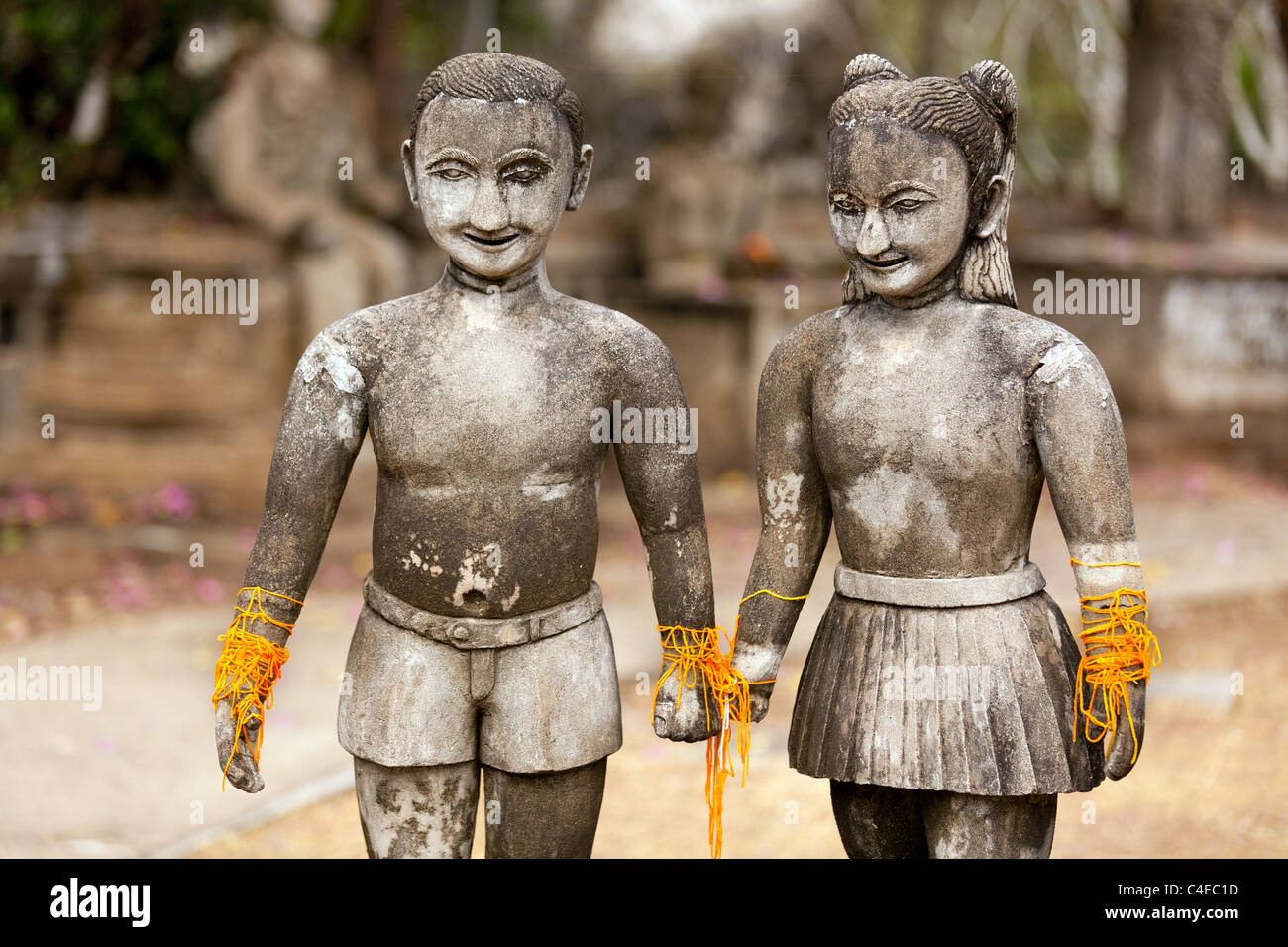 stone religious sculpture of couple holding hands, wat khaek temple, nong khai, thailand Stock Photo