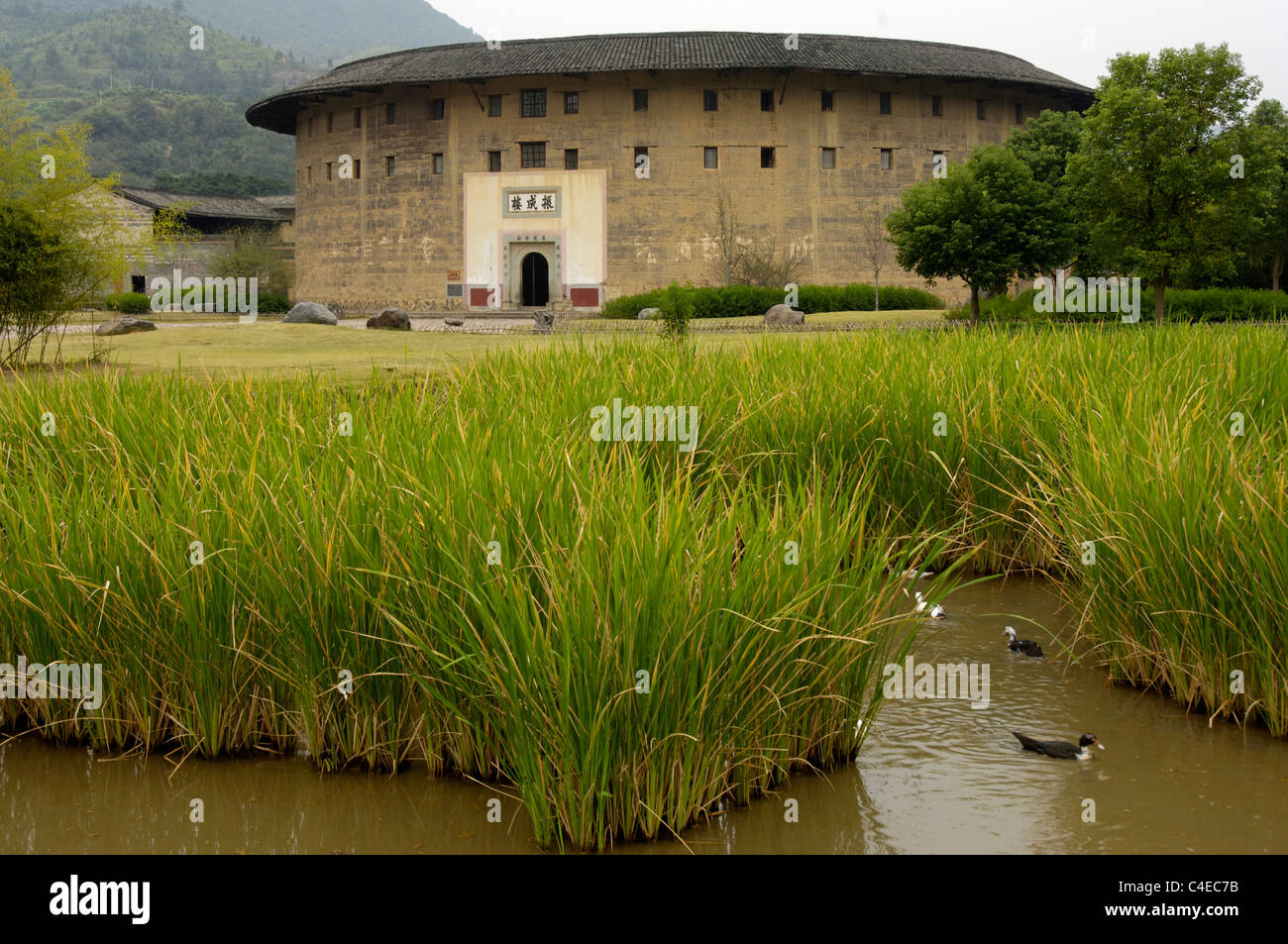 The Zhencheng Building, a fine example of a 4-storey tulou. Tulou are fortified, adobe (earth) Hakka clan houses, Stock Photo