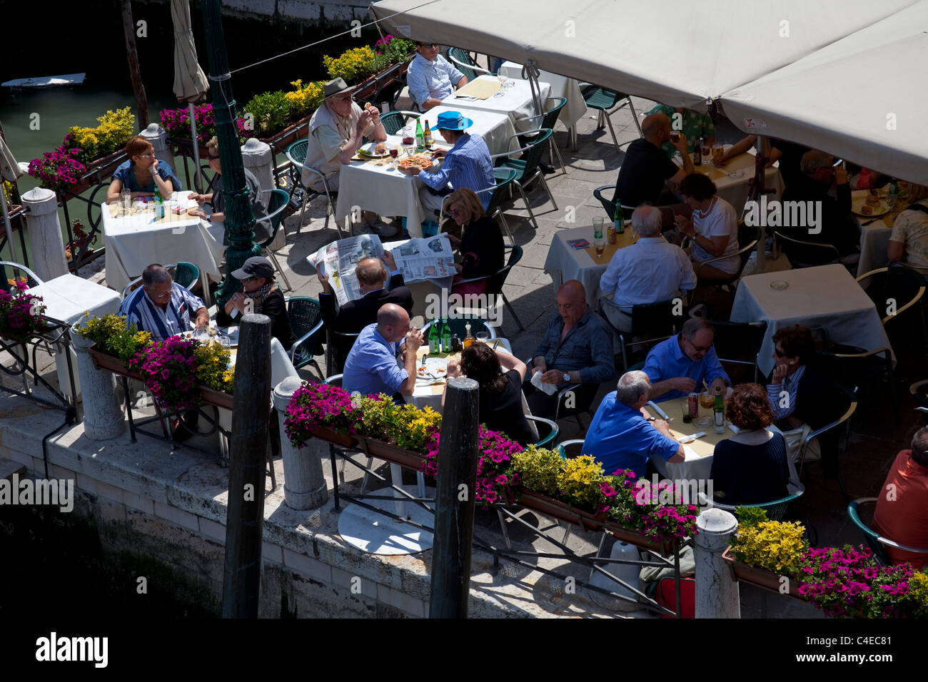 Venice Italy people eating and drinking alfresco in restaurant Stock Photo