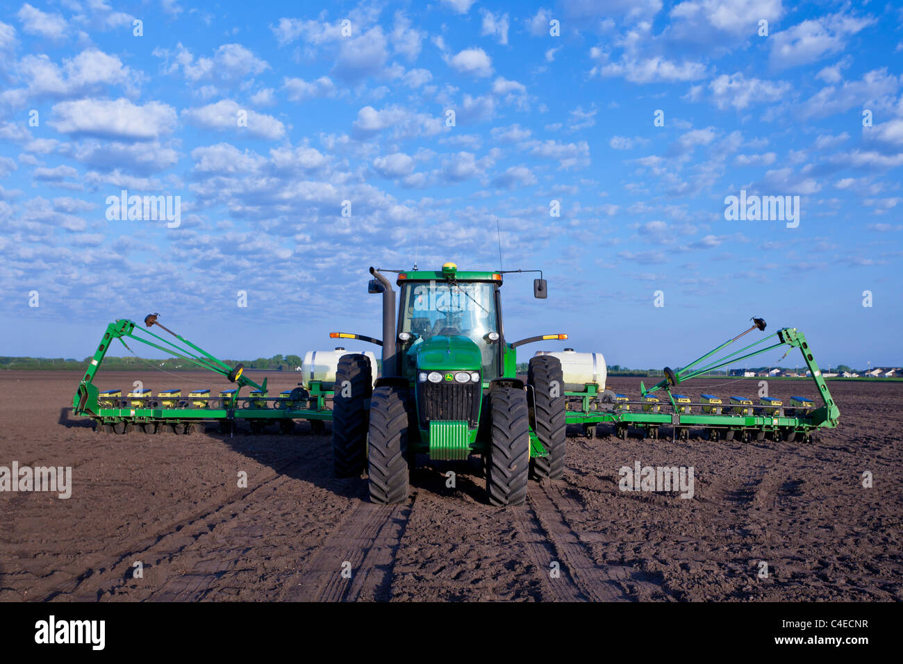 John Deere tractor and planters on a field on the Froese farm near Winkler, Manitoba, Canada. Stock Photo