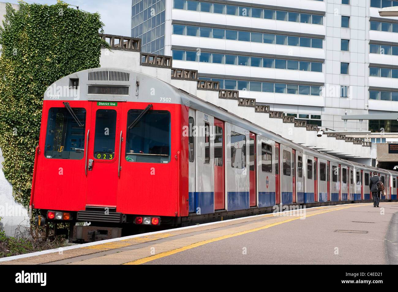 London Underground train waiting at an overground station on the District Line, London. Stock Photo