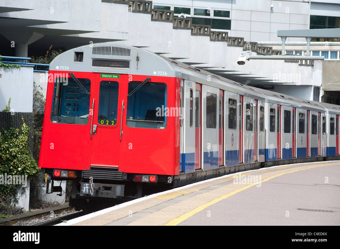 London Underground train waiting at an overground station on the District Line, London. Stock Photo