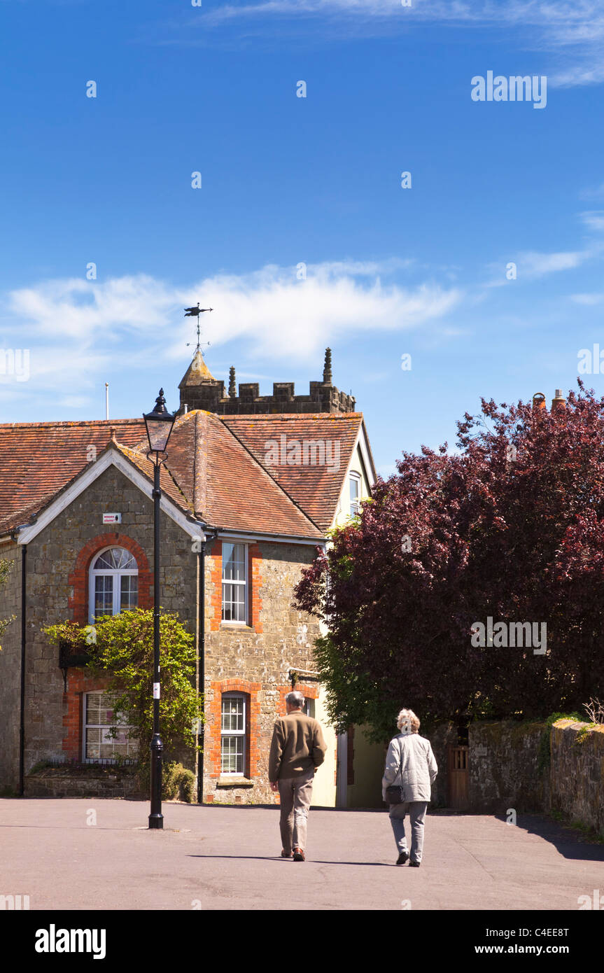 Couple walking in Shaftesbury, Dorset, England, UK Stock Photo