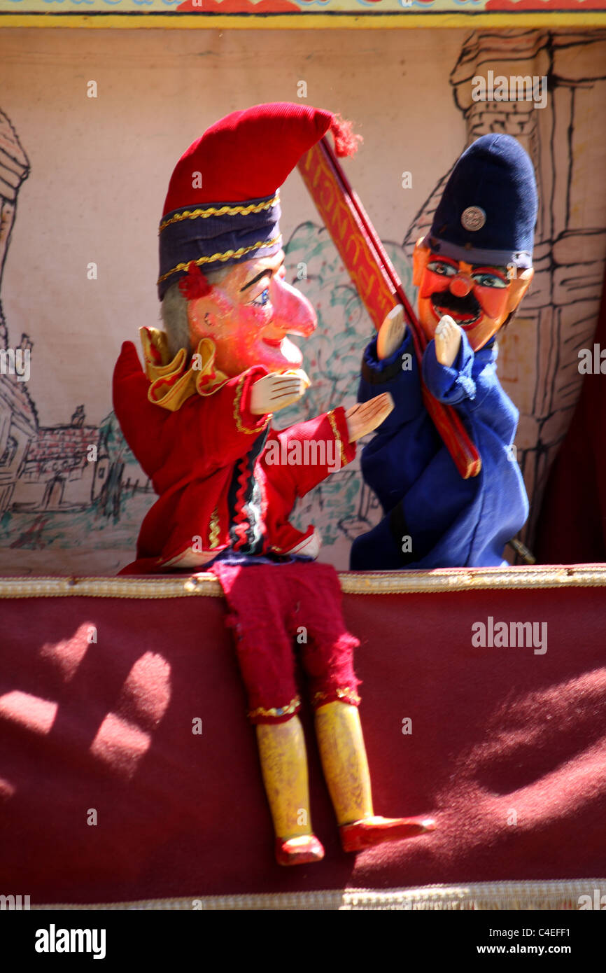 A Punch and Judy hand puppet seaside show for children on the beach in