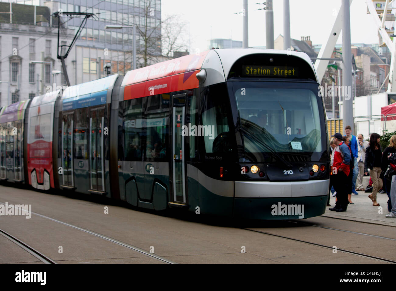 A modern tram in Nottingham city centre taking the general public, it's passengers to Station Street. Stock Photo