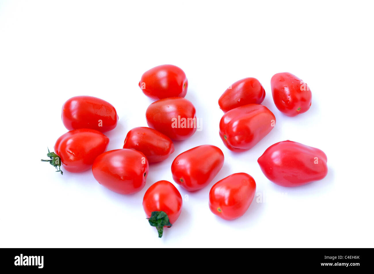 Cherry tomatoes on a white background Stock Photo - Alamy