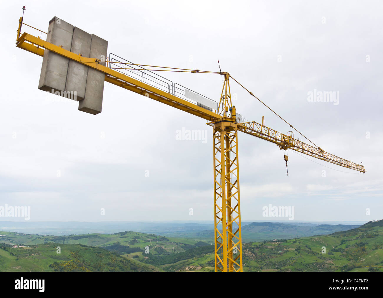 Massive concrete counterbalance weights on the boom arm of a tower crane Stock Photo