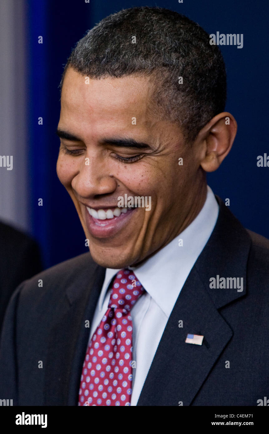 President Barack Obama bids farewell to White House Press Secretary Robert Gibbs. Stock Photo