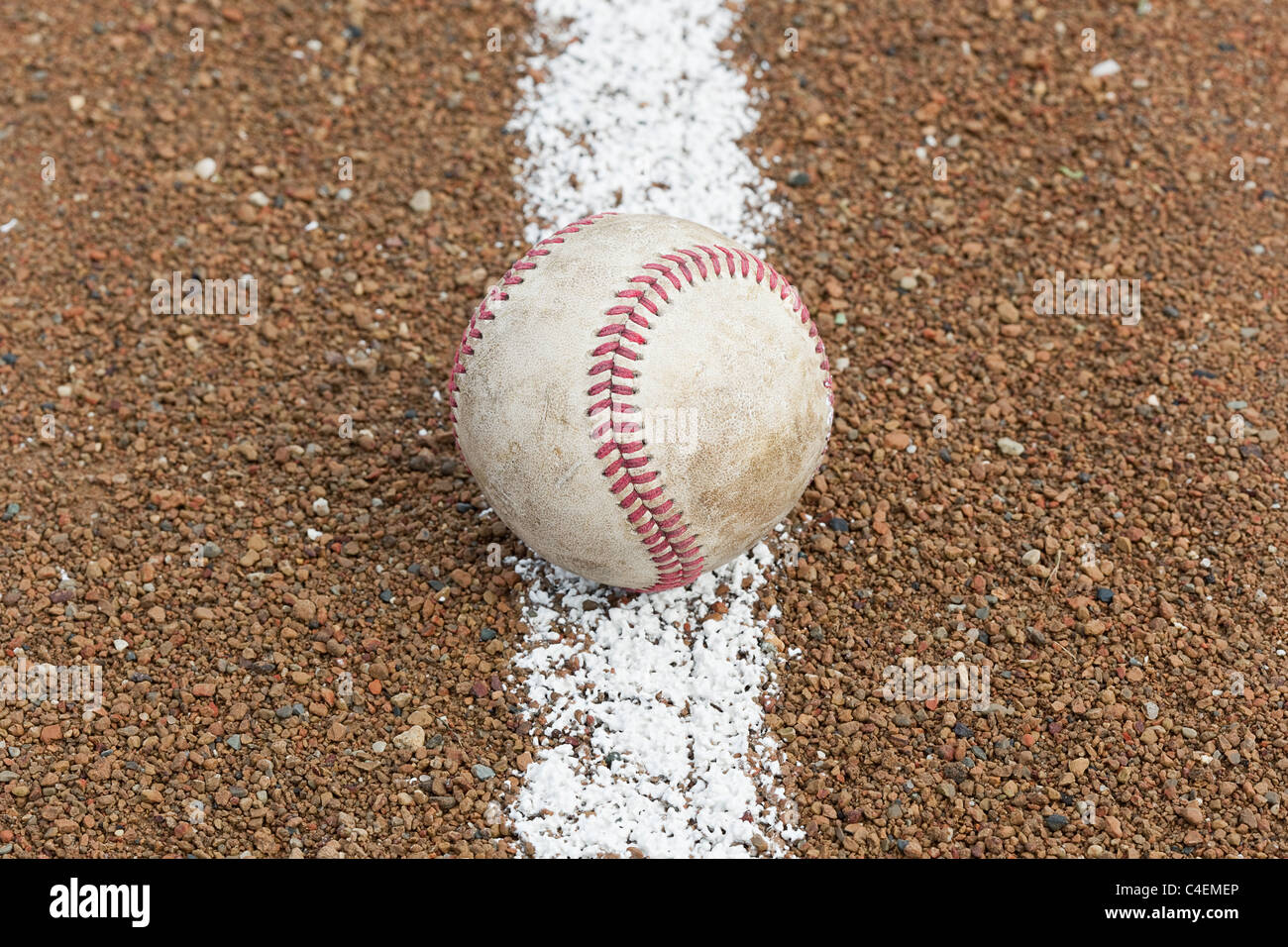 An old worn baseball on a baseball field Stock Photo - Alamy