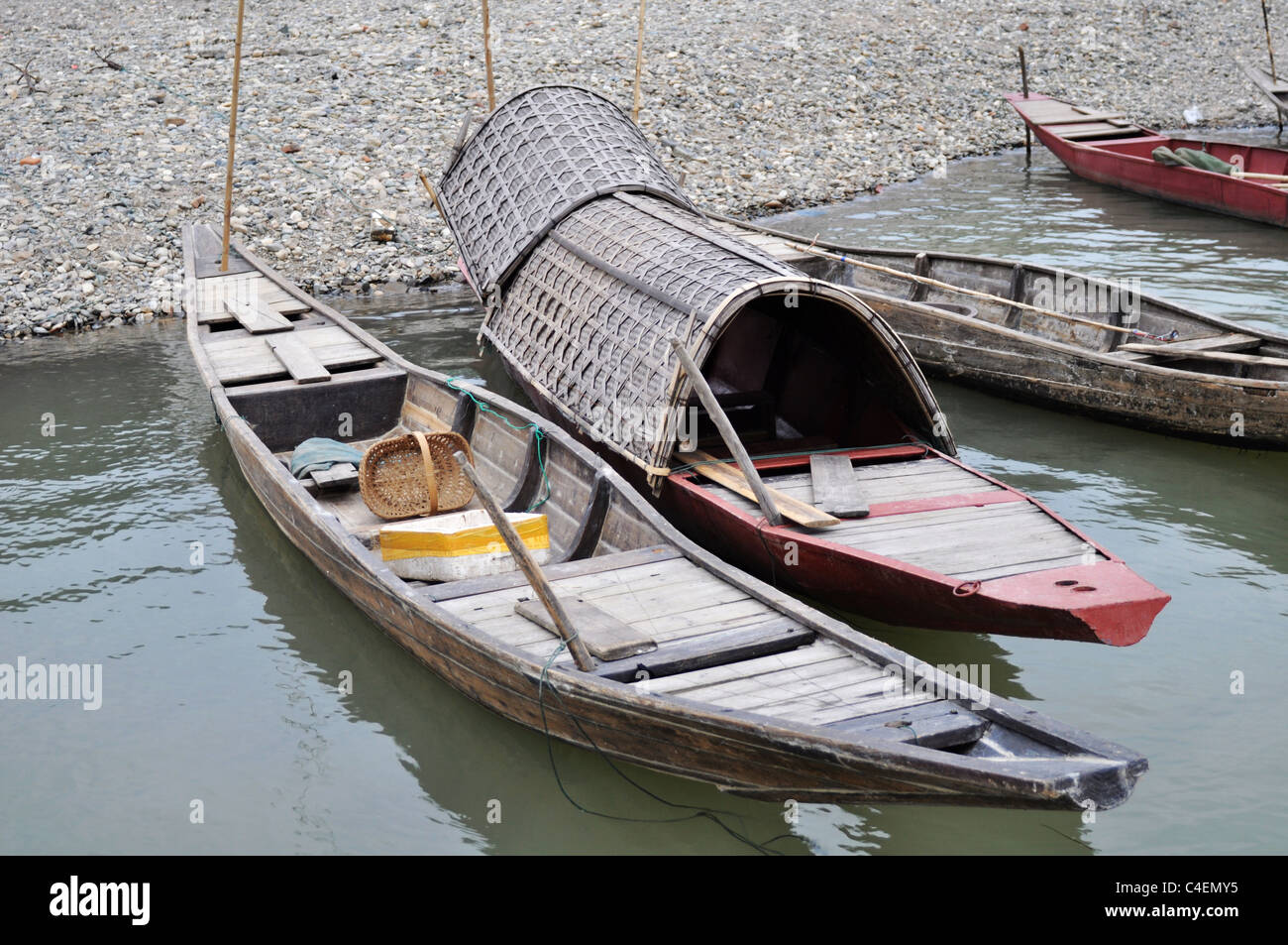 Scenery of wooden boats at the bank of a river Stock Photo