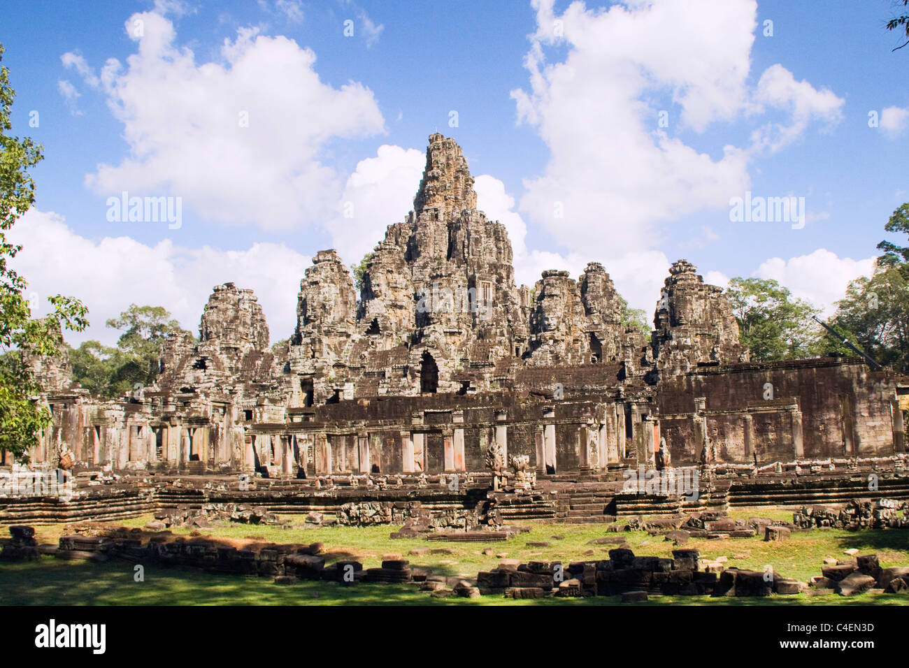Bayon Temple from a distance looks like a jumble but looking closer the towers are covered with giant carvings of enegmatic face Stock Photo