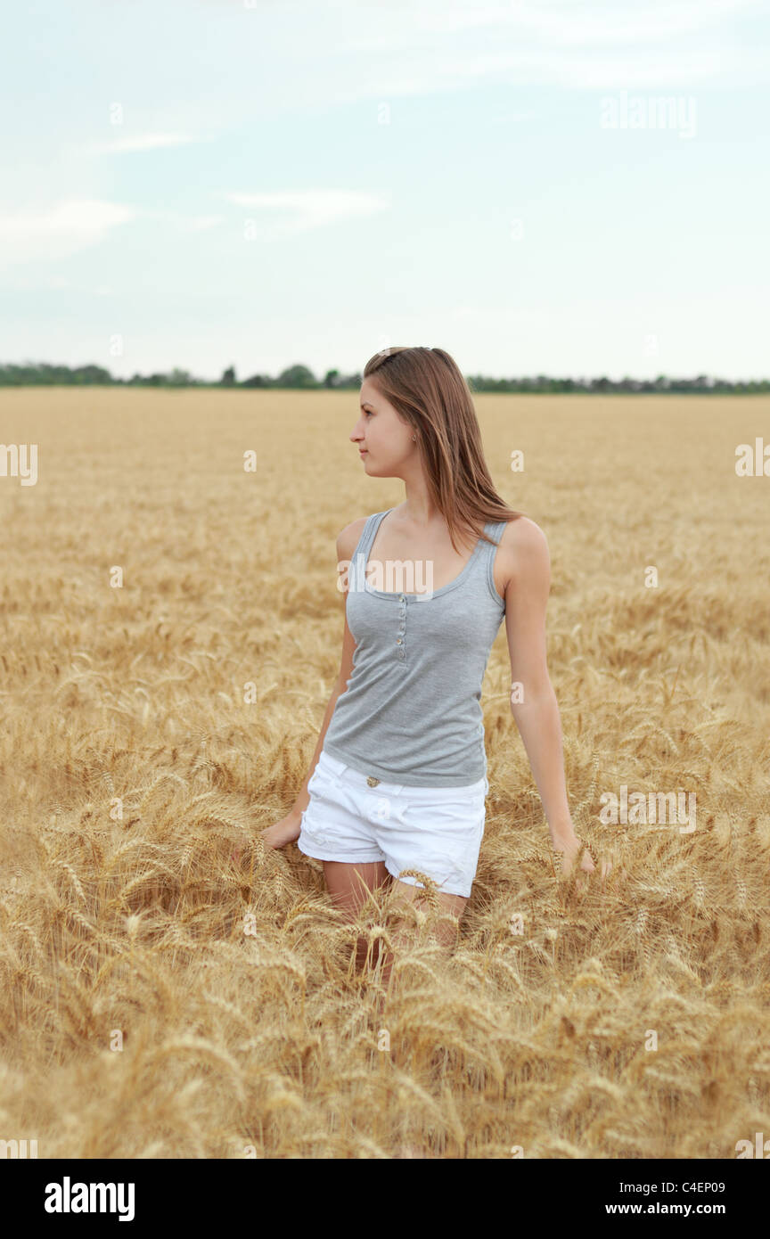 Young girl in the wheat field Stock Photo - Alamy