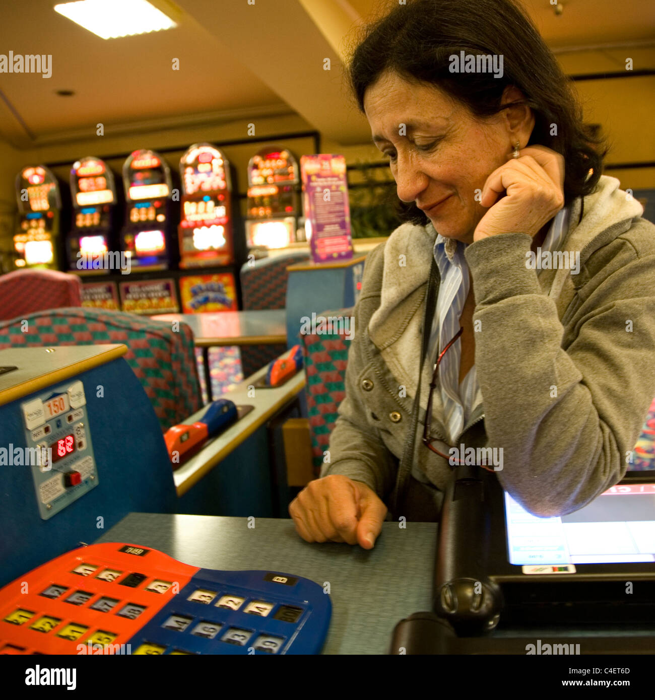 Woman playing table bingo at Beacon Bingo in London Stock Photo