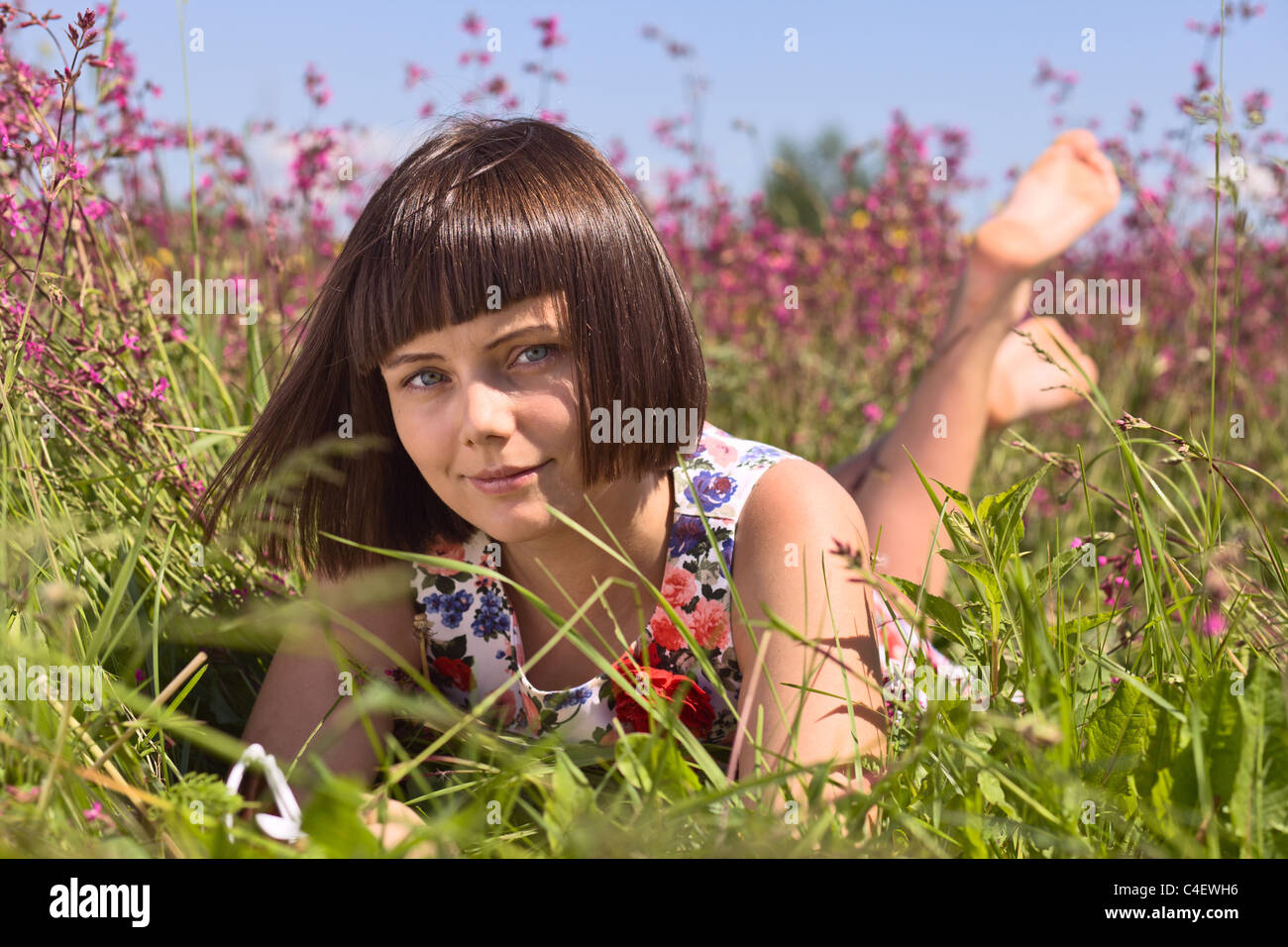 Young girl on a meadow Stock Photo - Alamy