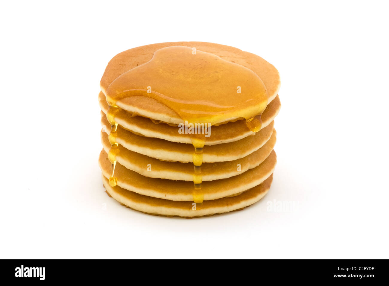 Stack of pancakes isolated on white with syrup Stock Photo