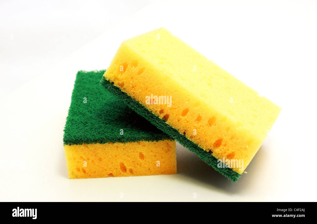 Yellow kitchen sponge for washing dishes isolated on white