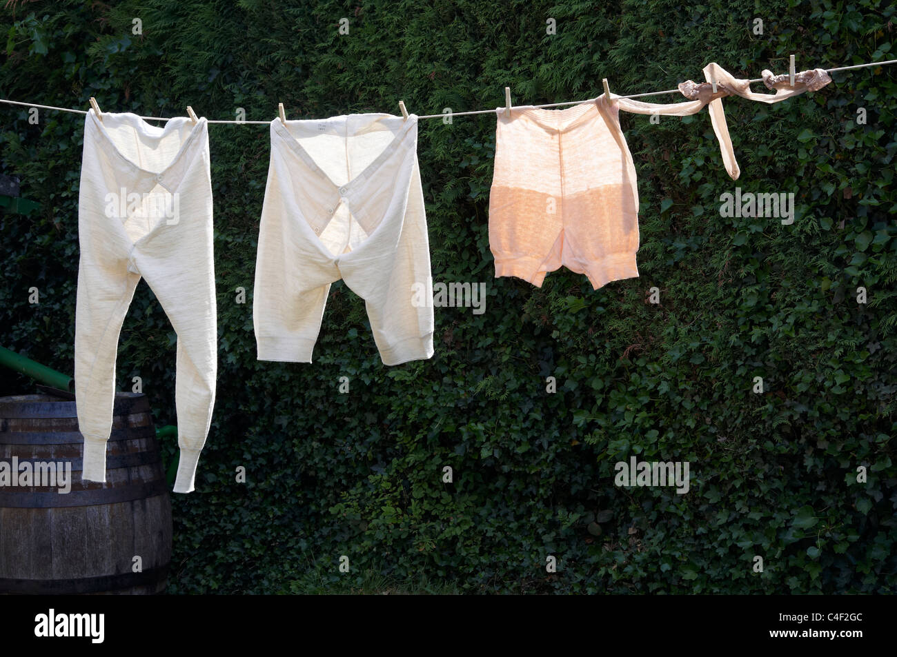 1940's underwear - male trunks and long johns plus women's pants hanging on  a washing line Stock Photo - Alamy