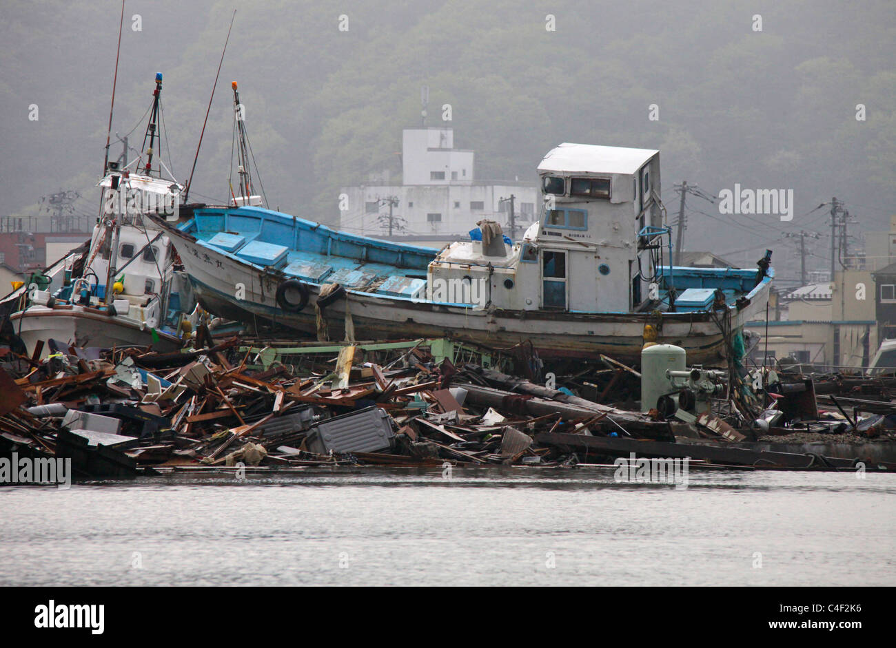 A fishing boat tossed ashore by tsunami Ishinomaki Miyagi Japan Stock Photo