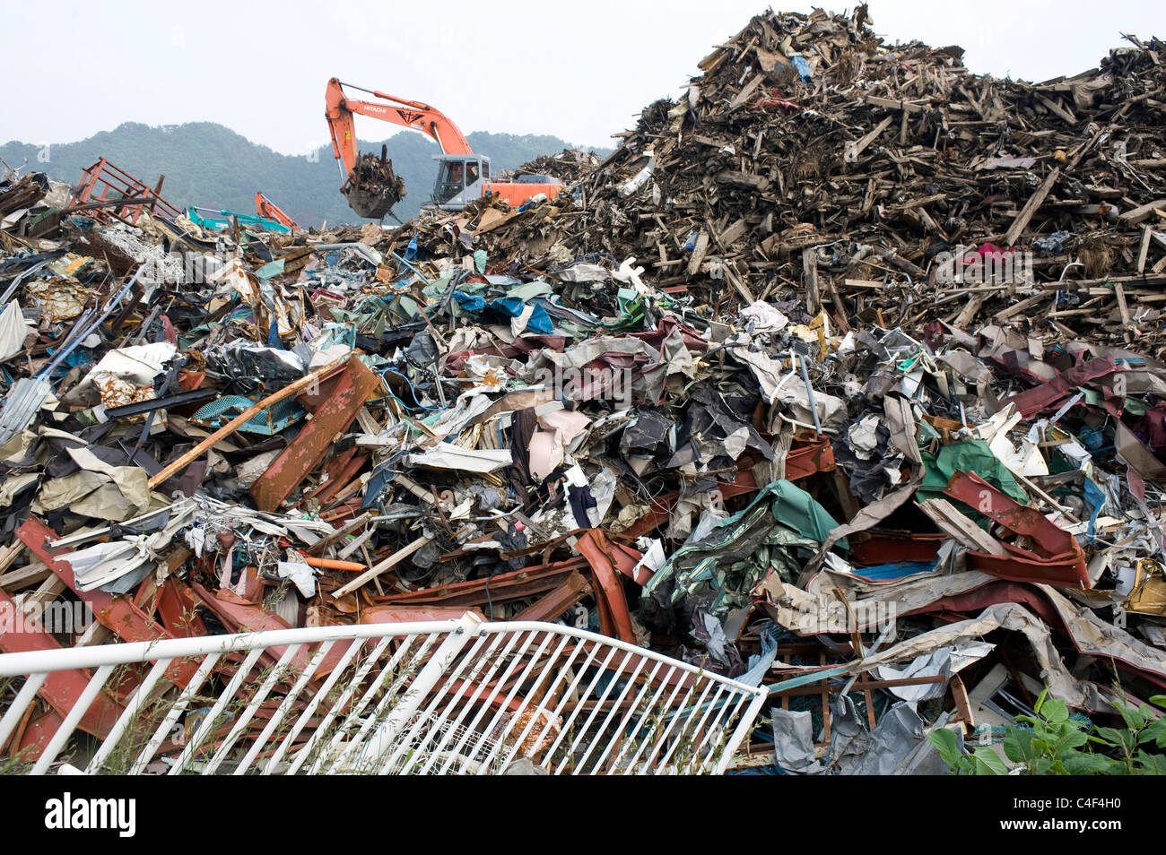 3  months after the magnitude 9 quake and tsunamis hit Japan, workers are still sifting through the debris in Otsuchi, Japan Stock Photo