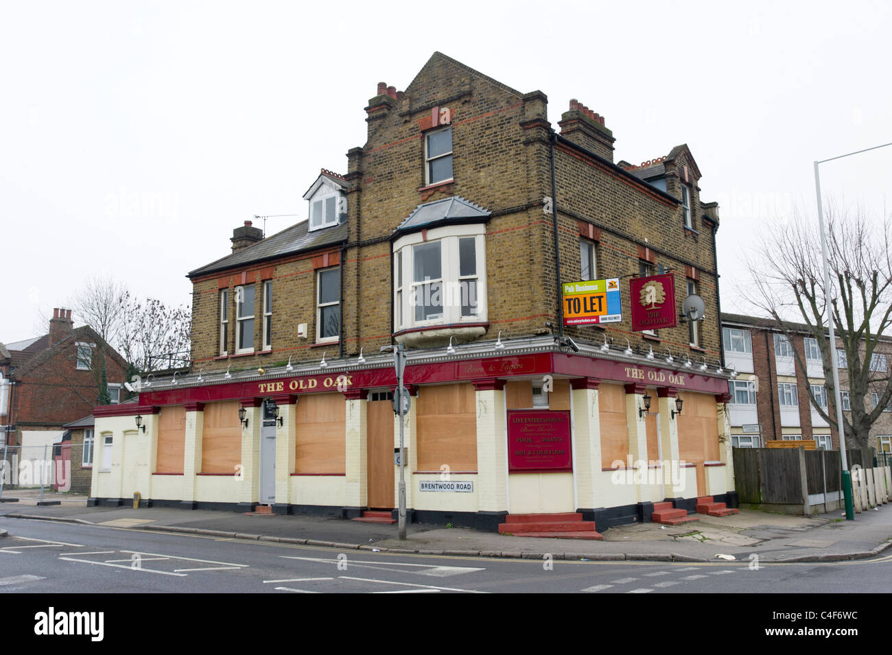 Boarded up pub which has gone out of business, Romford, London, UK Stock Photo