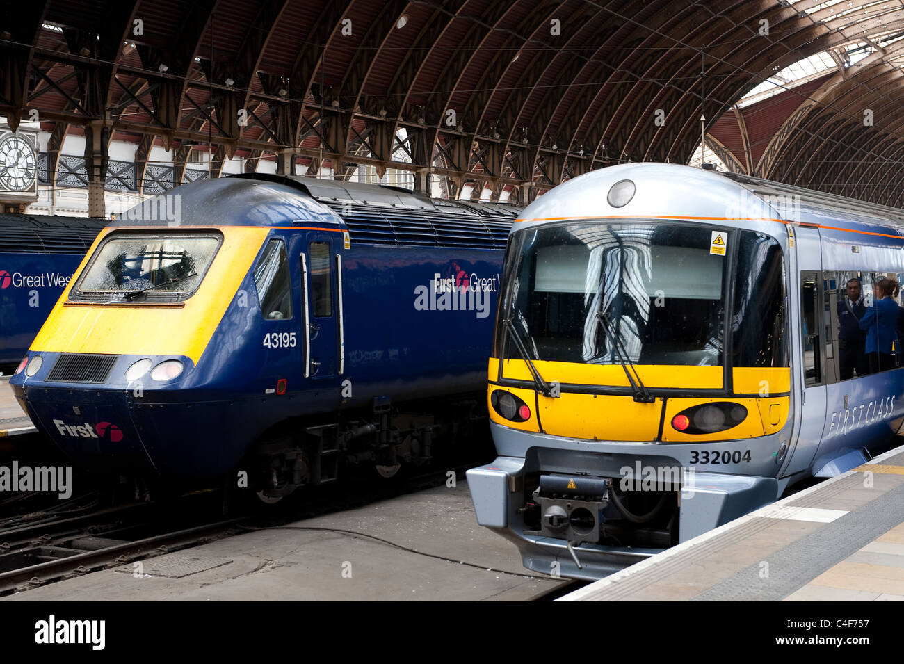 Heathrow Express class 332 and First Great Western class 43 trains waiting at a platform at Paddington Railway Station, London. Stock Photo