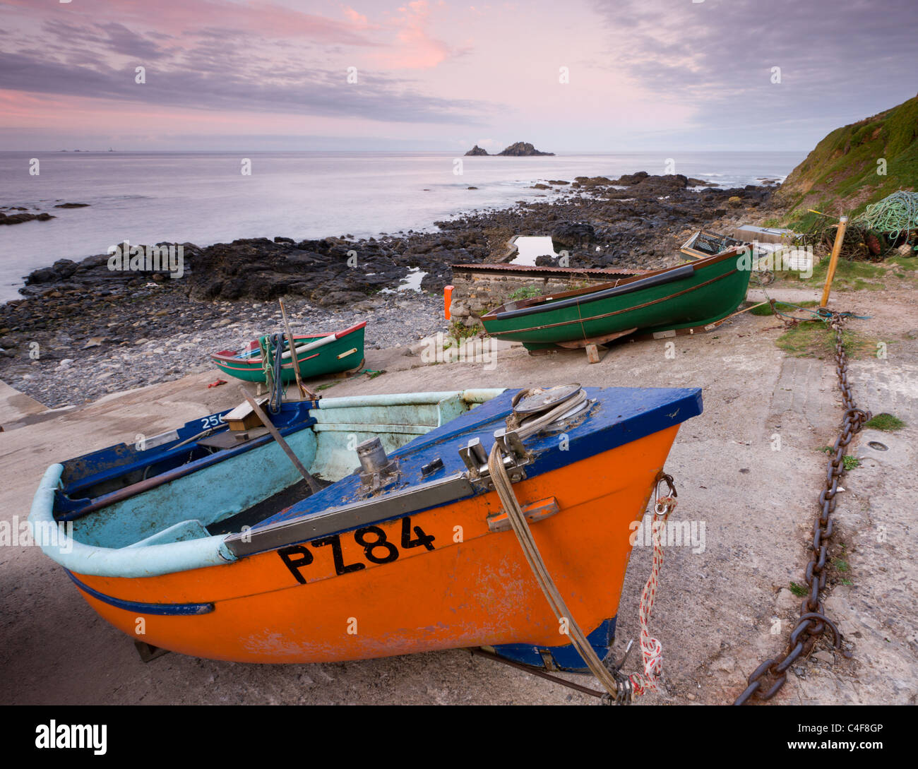 Fishing boats pulled high up the slipway at Priest's Cove, Cape Cornwall near St Just, Cornwall, England. Autumn (October) 2009. Stock Photo
