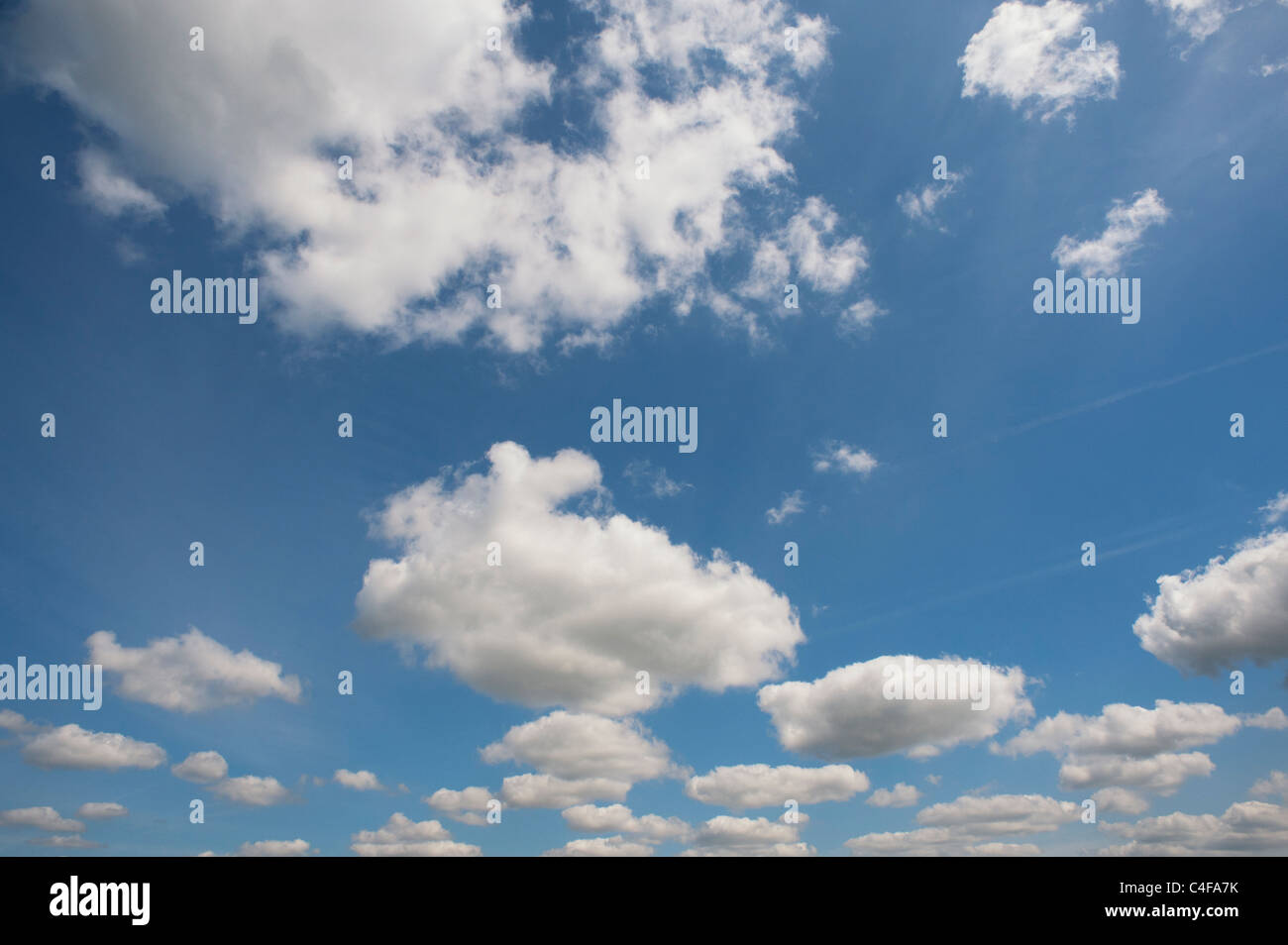 Blue sky with fluffy clouds Stock Photo