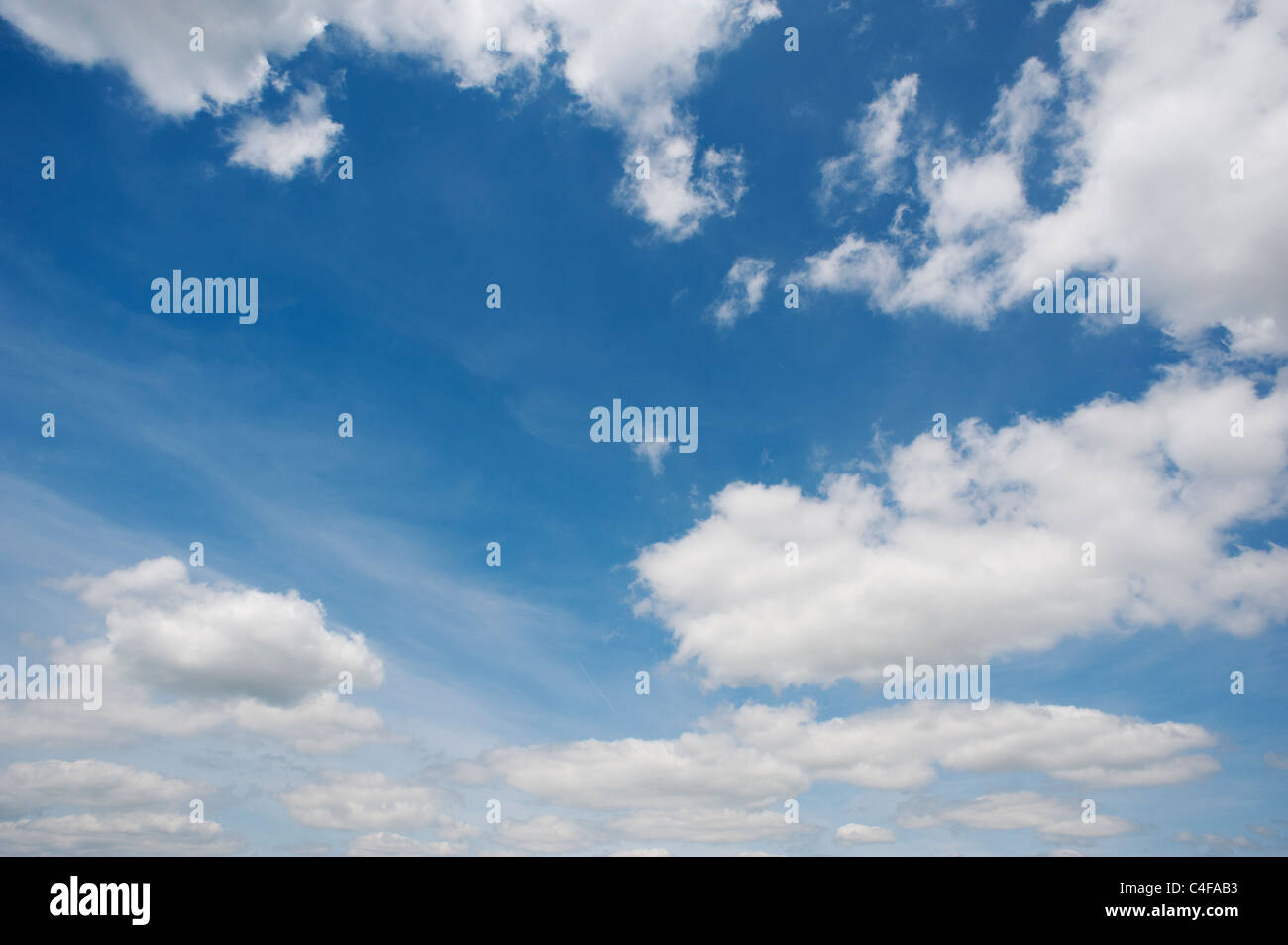 Blue sky with fluffy clouds Stock Photo