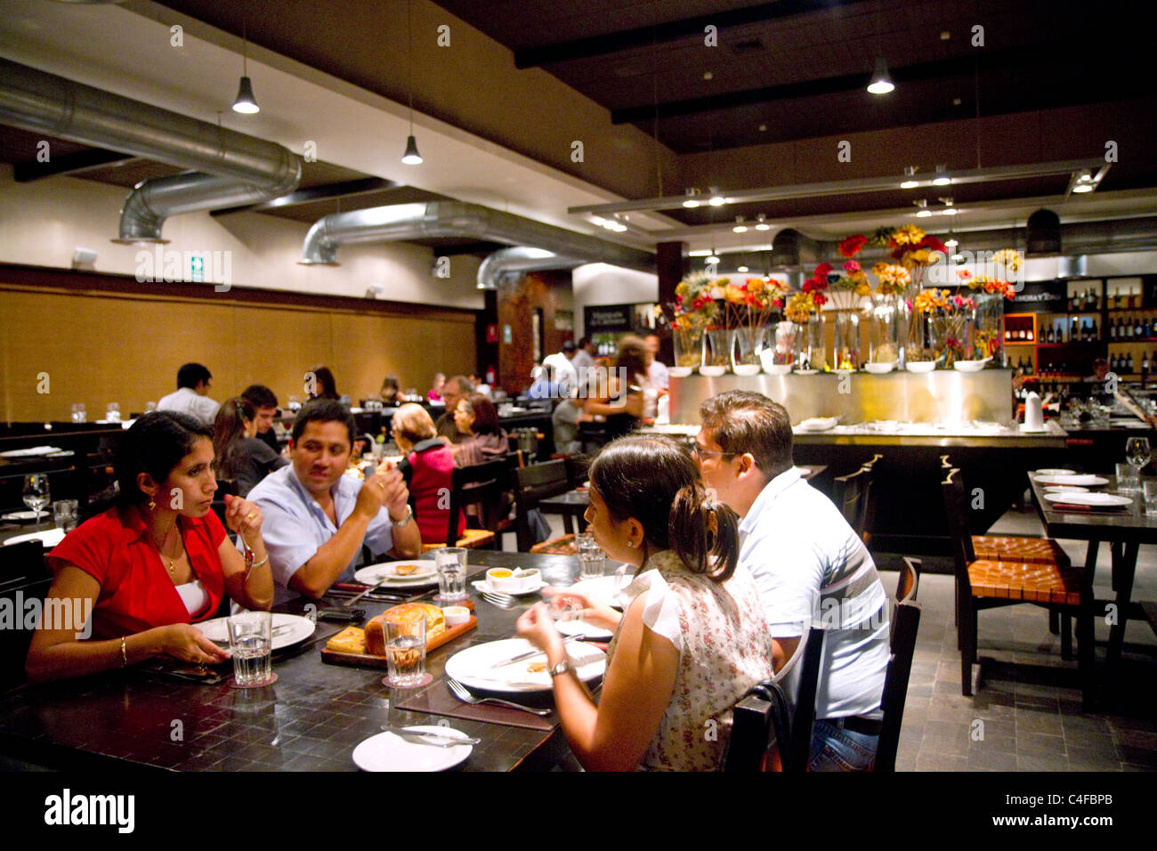 People dine at a restaurant in the Miraflores district of Lima, Peru. Stock Photo