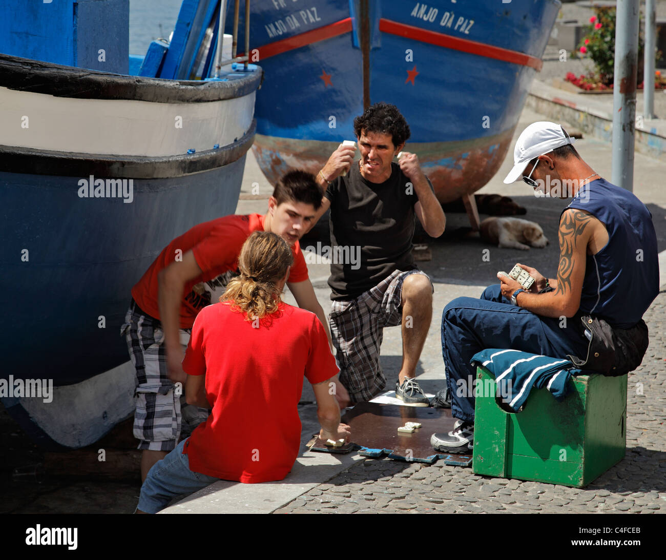 Local fishermen playing dominoes, Camara de Lobos, Madeira. Stock Photo