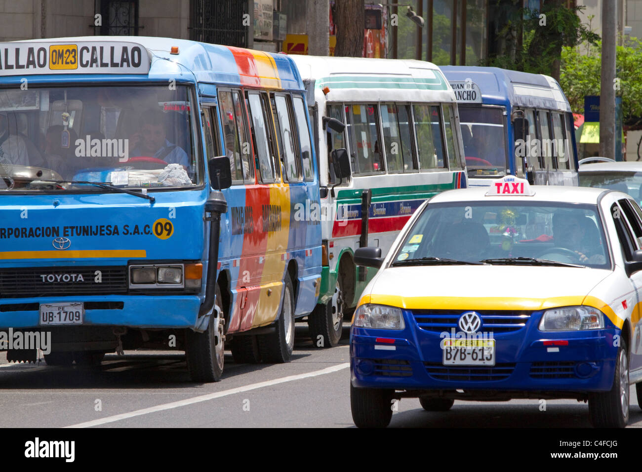 Public transportation buses and taxicab in Lima, Peru. Stock Photo