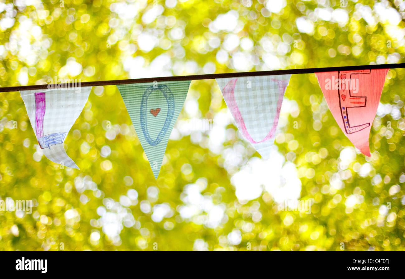 A line of bunting flags spelling "Love Stock Photo Alamy