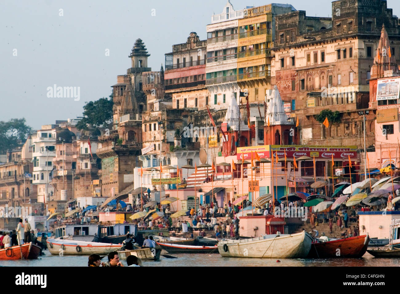 Boats waiting to take tourist and pilgrams for a ride on the River Ganges.Varanasi, India Stock Photo